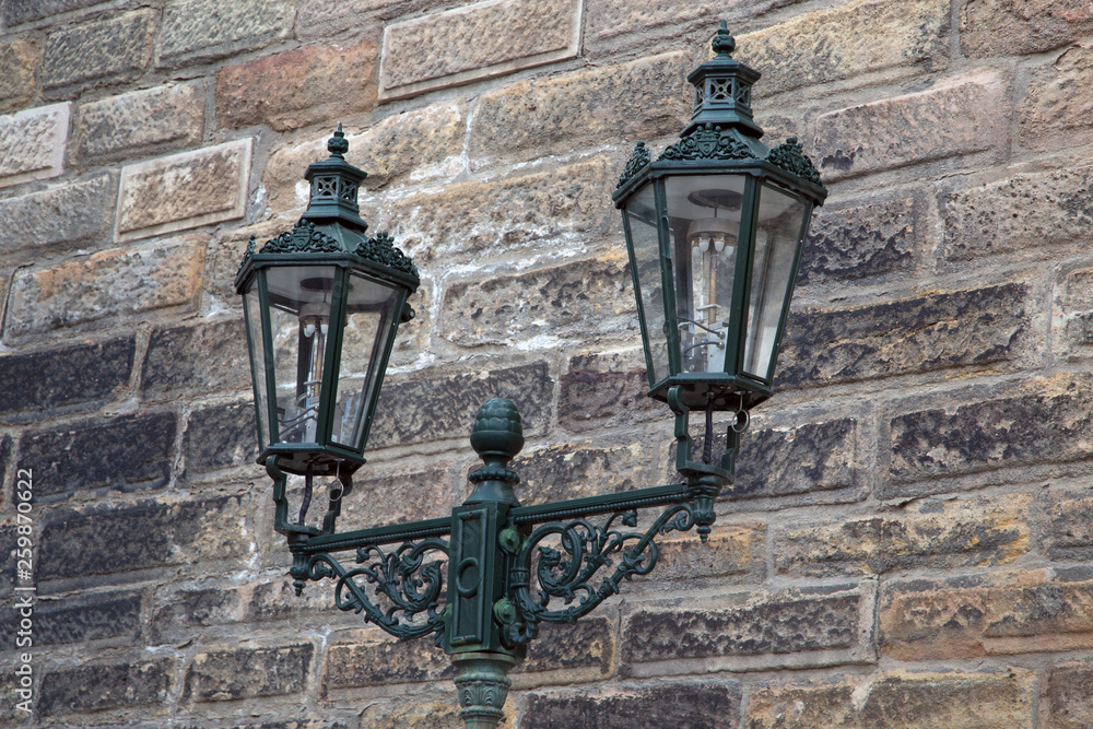 Street lamp on a brick wall background