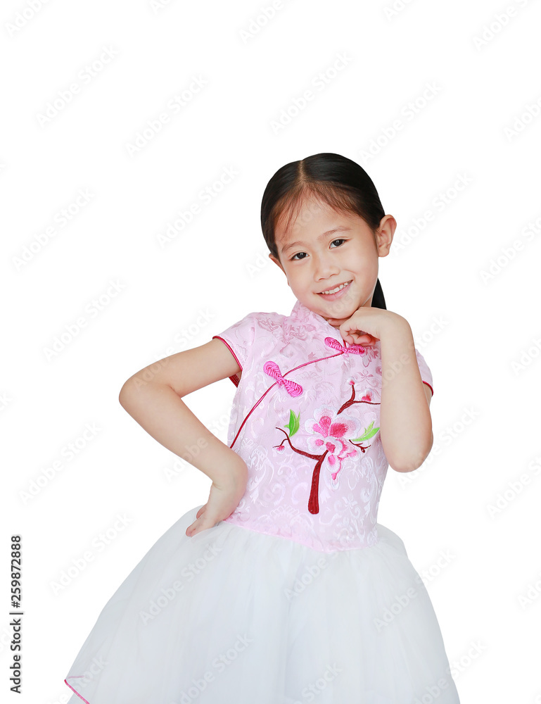 Happy little Asian child girl wearing pink Tradition Chinese dress for Chinese New Year celebration isolated on white background. Happy little Asian child girl wearing pink Tradition Chinese dress for Chinese New Year celebration isolated on white background.