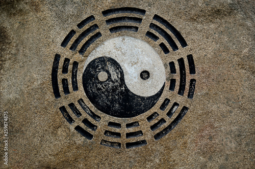 Yin yang symbol on sand rock in China