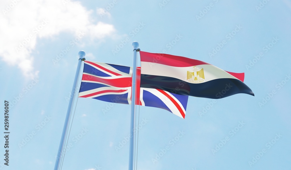 UK and Egypt, two flags waving against blue sky. 3d image UK and Egypt, two flags waving against blue sky. 3d image