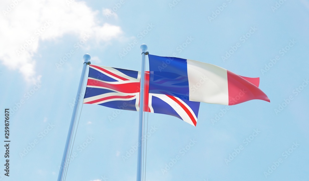 UK and France, two flags waving against blue sky. 3d image