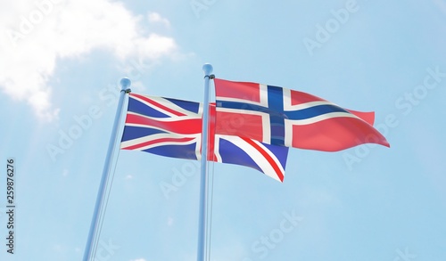 UK and Norway, two flags waving against blue sky. 3d image