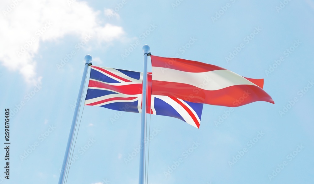UK and Austria, two flags waving against blue sky. 3d image