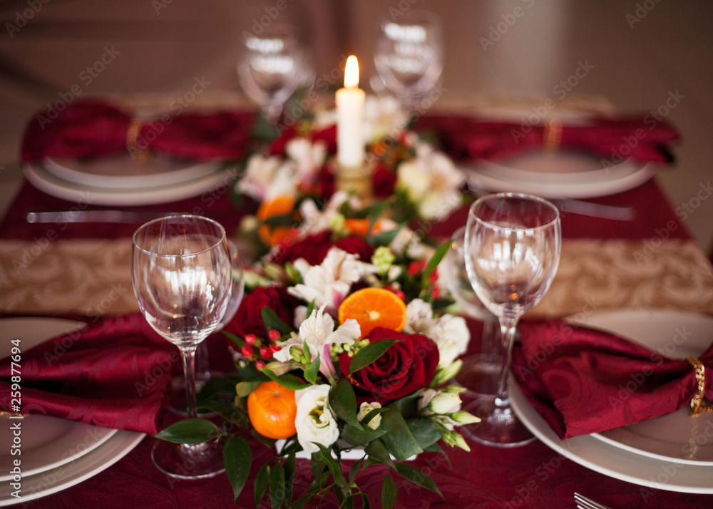 Table setting set with candles and flowers Table setting set with candles and flowers