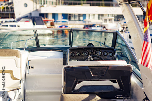 Inside of a speed boat anchored in a marina. © borevina