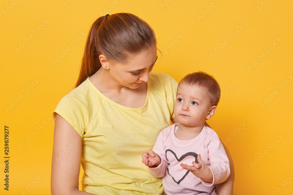 A joyful mother lookes after her adorable daughter . A woman gives a sweet gaze, checks how a cute baby counting. A smart kid sits at her mother`s knees and looks in her eyes attentively. A joyful mother lookes after her adorable daughter . A woman gives a sweet gaze, checks how a cute baby counting. A smart kid sits at her mother`s knees and looks in her eyes attentively.