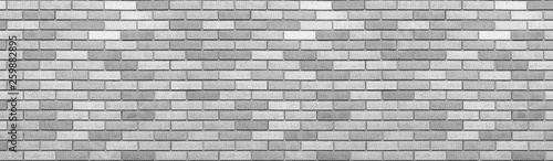 Abstract gray brick wall texture background. Horizontal panoramic view of masonry brick wall.