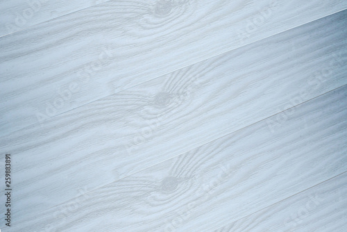 light wood texture with a pearl blue shade for the background, boards diagonally