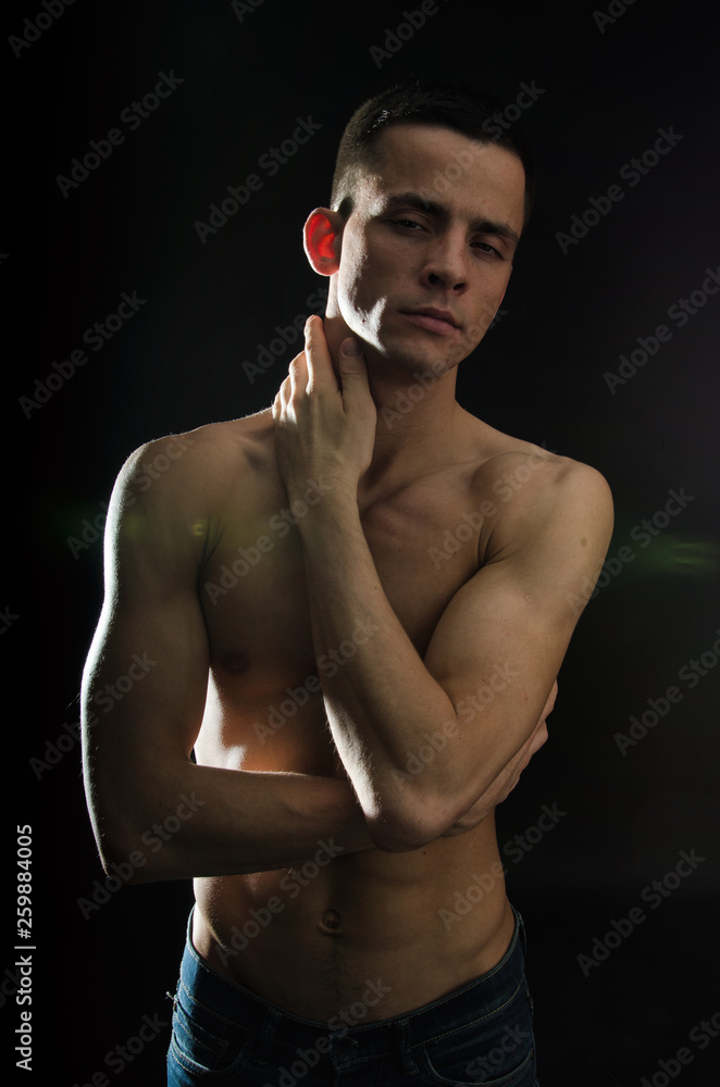 Fototapeta premium Young sexy guy with a beautiful body.