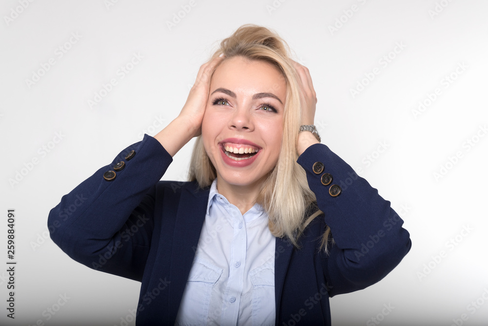 The blonde in the blue suit much smiling on white background The blonde in the blue suit much smiling on white background