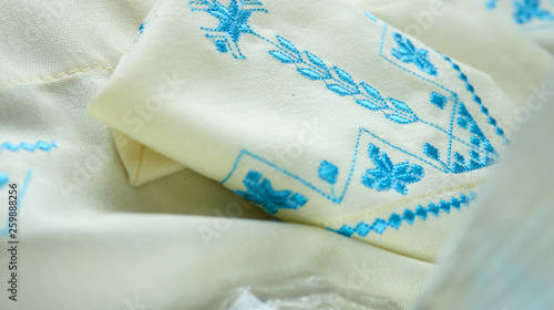 blue embroidery on white kitchen towel