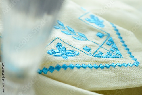 blue embroidery on white kitchen towel