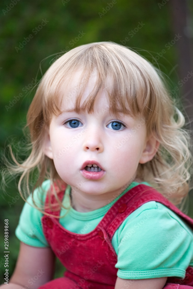 cute two years old blonde white girl closeup portrait on summer outdoor background cute two years old blonde white girl closeup portrait on summer outdoor background