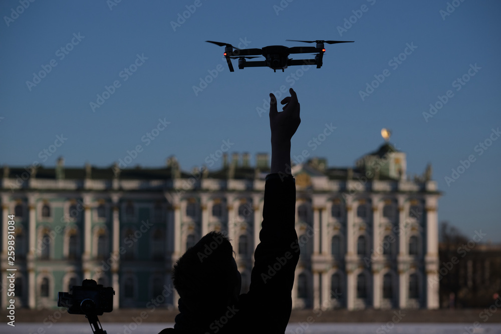 Fototapeta premium Drone flies over the city center on the background of the sights of St. Petersburg. Photographs and videotaping.