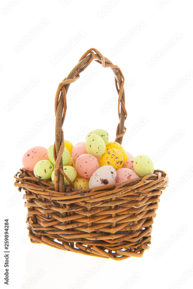 Wicker basket with easter eggs Wicker basket with easter eggs