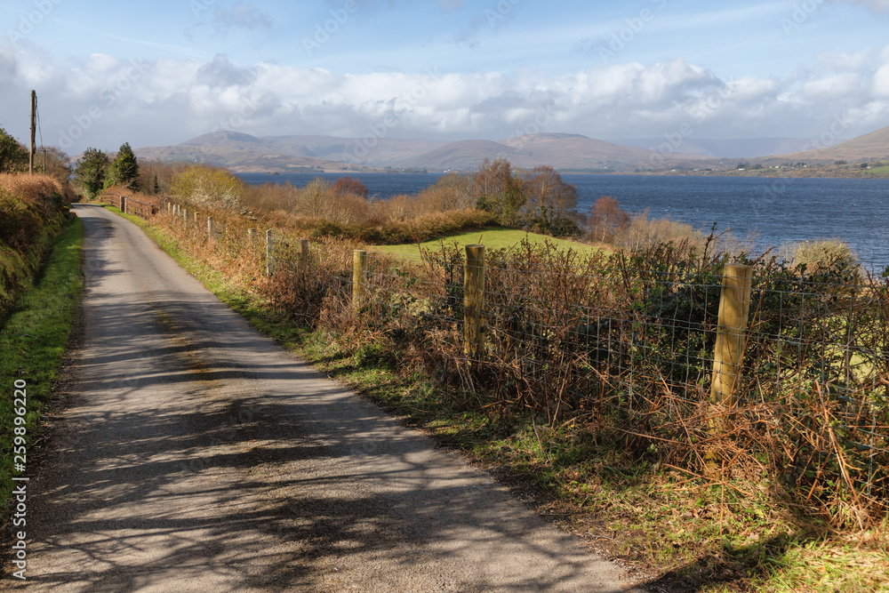 Mountain, road, lake and vegetation at Western way trail in Lough Corrib