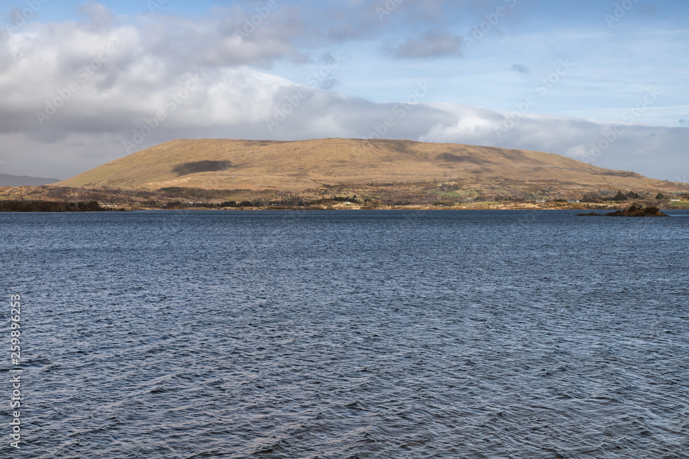 Mountain, lake and vegetation at Western way trail in Lough Corrib Mountain, lake and vegetation at Western way trail in Lough Corrib
