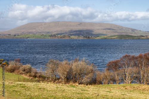 Mountain, lake and vegetation at Western way trail in Lough Corrib photo