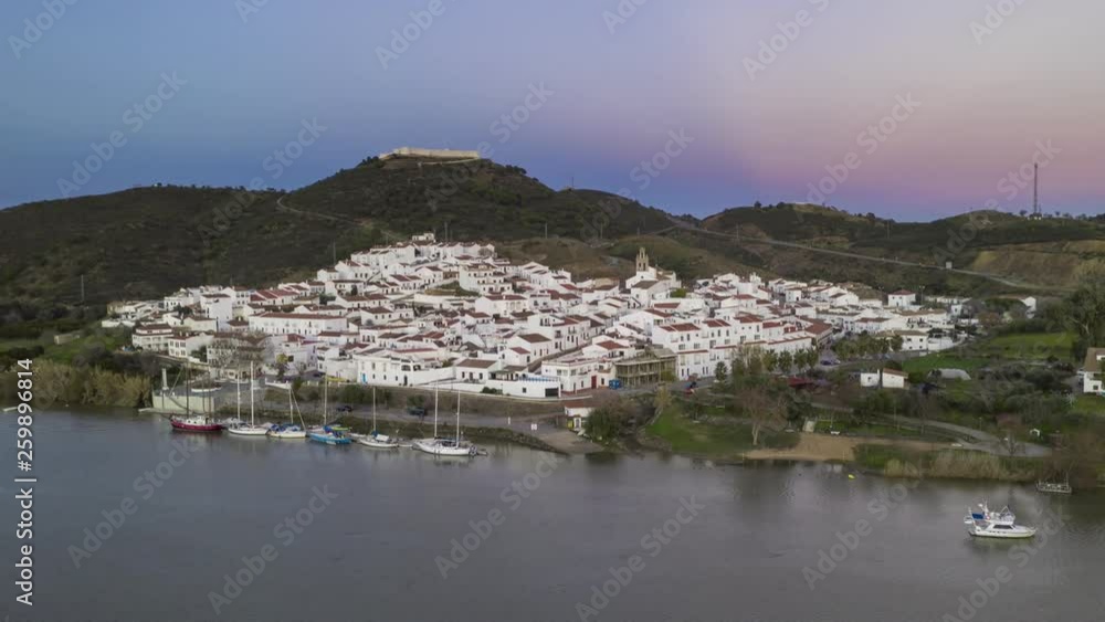 Drone Hyperlapse moving timelapse of Sanlucar de Guadiana in Spain, from Alcoutim in Portugal Drone Hyperlapse moving timelapse of Sanlucar de Guadiana in Spain, from Alcoutim in Portugal
