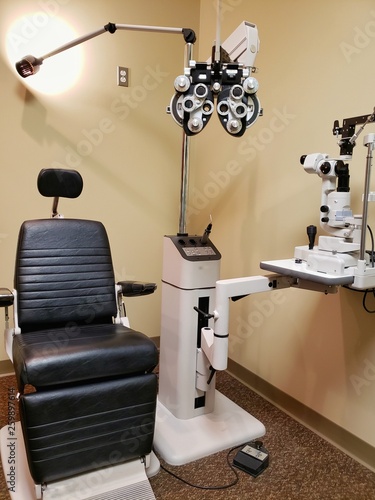 Examination room of an optometrist ready for a patient. Equipment used to check eyesight and diagnose issues. Determine proper prescription for eyeglasses.