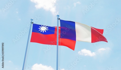 France and Taiwan, two flags waving against blue sky. 3d image