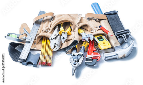 construction tools in leather toolbelt isolated on white