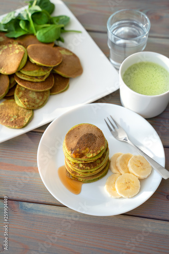 Dietary pancakes with spinach. Stack of pancakes