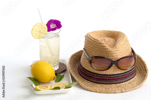 summer concept lemon and glasses  ,straw hat on white background