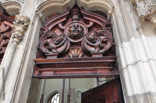 medieval wooden door with fresco, gargoyles in bavaria