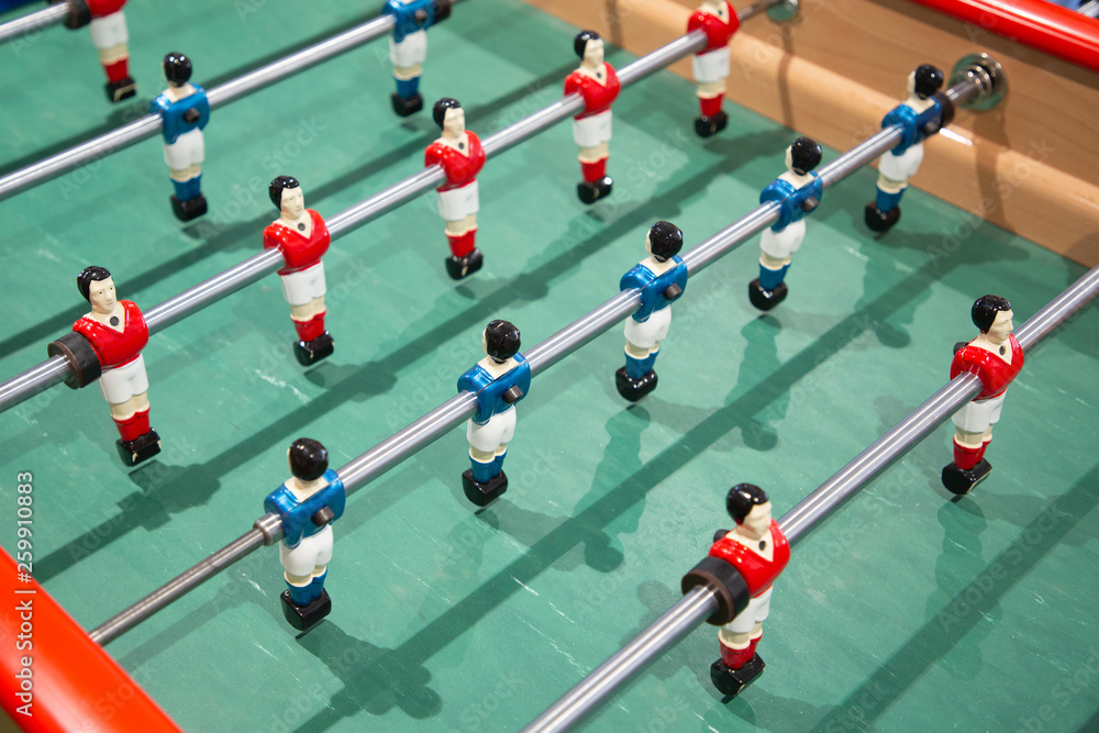 Close-up of Table football soccer game on green field baby foot Close-up of Table football soccer game on green field baby foot