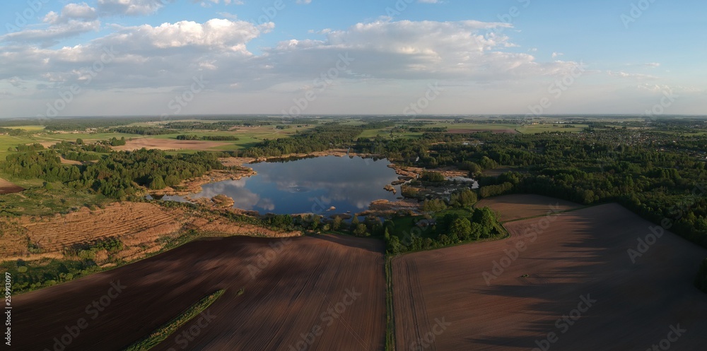 Spring cultivated agriculture fields, groves and lake panorama, aerial Spring cultivated agriculture fields, groves and lake panorama, aerial