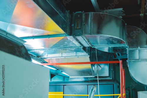 Close-up view of the modern big dimensions ductwork installed on the ceiling of the ventilation plant room photo