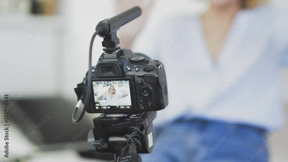 Popular female blogger is turning on the camera and strating recording video Popular female blogger is turning on the camera and strating recording video