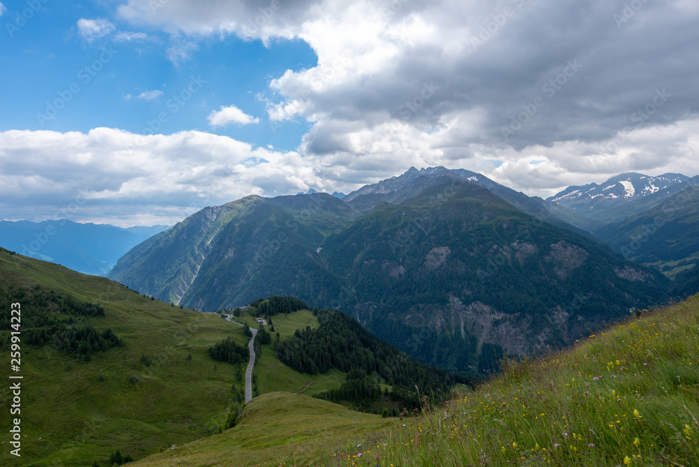 Fototapeta premium Mountain landscape small road clouds