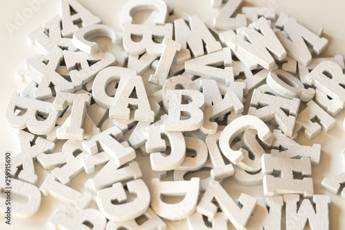 flat lay wooden letters, close up, white background