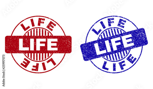 Grunge LIFE round stamp seals isolated on a white background. Round seals with grunge texture in red and blue colors. Vector rubber watermark of LIFE caption inside circle form with stripes.