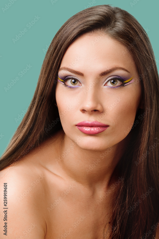 beautiful girl looking to the camera. shoulder portrait on background jungle shade green color beautiful girl looking to the camera. shoulder portrait on background jungle shade green color