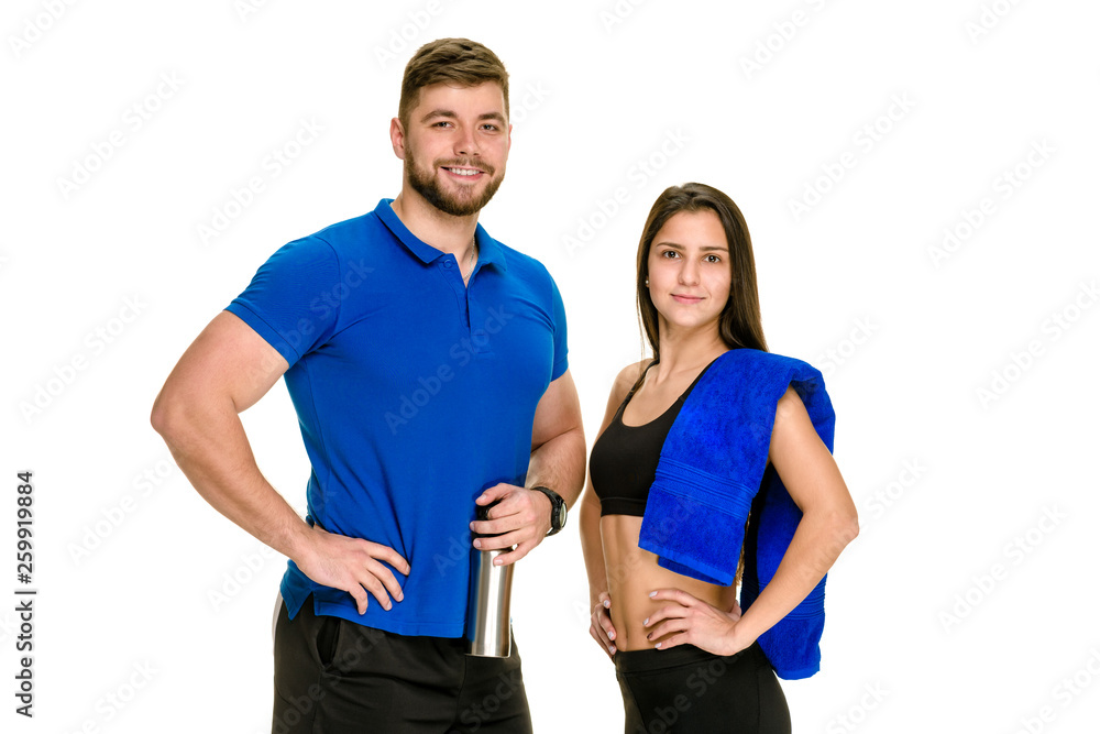 Fototapeta premium Cheerful athletic man and woman with towel after fitness exercise