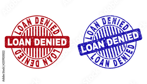 Grunge LOAN DENIED round stamps isolated on a white background. Round seals with grunge texture in red and blue colors. Vector rubber imitation of LOAN DENIED tag inside circle form with stripes.