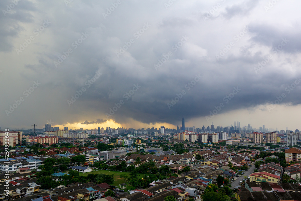 Lightning storm over downtown Kuala Lumpur skyline during monsoon season. 
