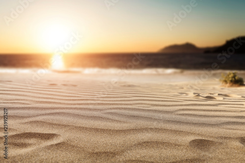 Fototapeta Naklejka Na Ścianę i Meble -  Summer background of sand on beach and blue sky with sun light. Free space for your decoration. 