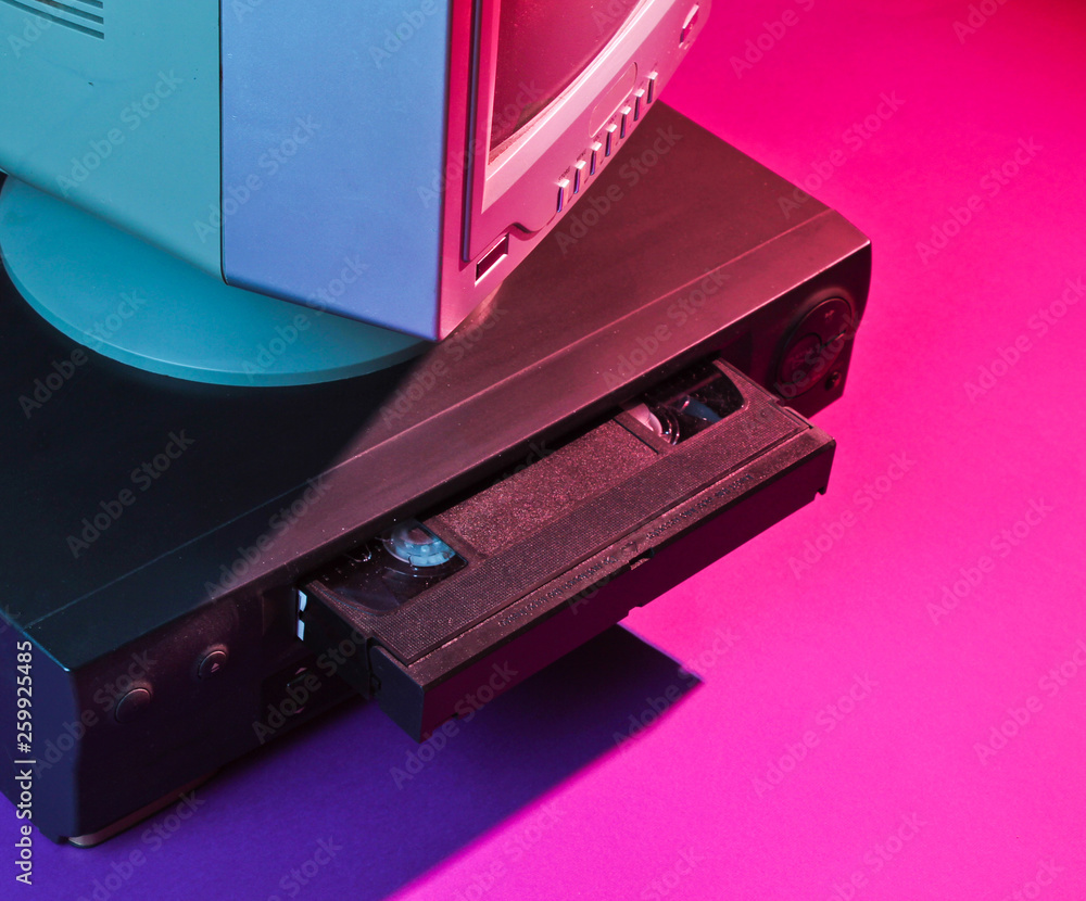 Retro wave, 80s concept. Video player with vhs cassette, old tv, neon light. - obrazy, fototapety, plakaty 