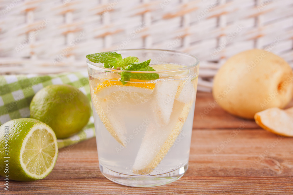 Pear Lemonade or mojito cocktail with pear, lemon and mint, cold refreshing drink or beverage Pear Lemonade or mojito cocktail with pear, lemon and mint, cold refreshing drink or beverage