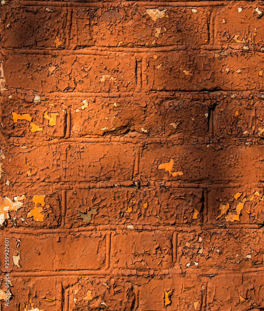 Obraz premium old cracked painted brick wall