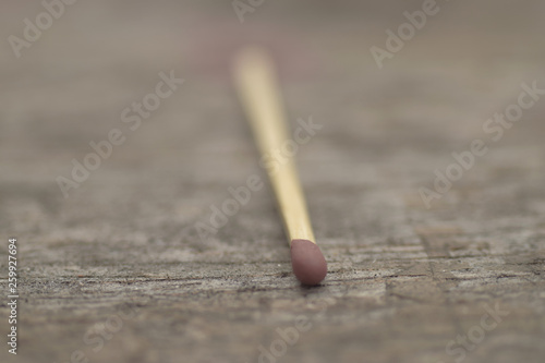 Match stick on wooden background