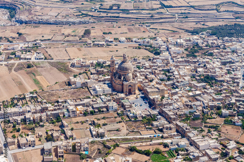 Rural Gozo island as seen from above. Aerial view of Gozo, Malta. The Rotunda of Xewkija, Casal Xeuchia is the largest in Gozo island and its dome dominates the island everywhere photo