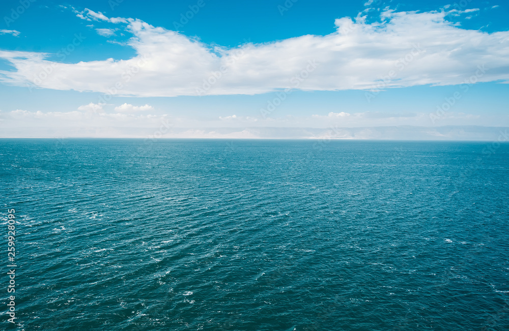 Obraz premium Blue sea and clouds on sky