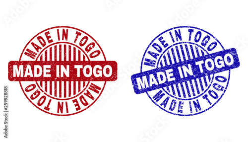 Grunge MADE IN TOGO round stamp seals isolated on a white background. Round seals with grunge texture in red and blue colors.