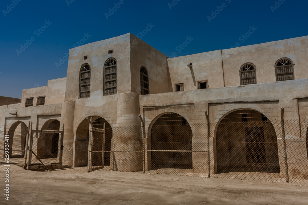A facade and entrance to Aqeer Castle, Saudi Arabia