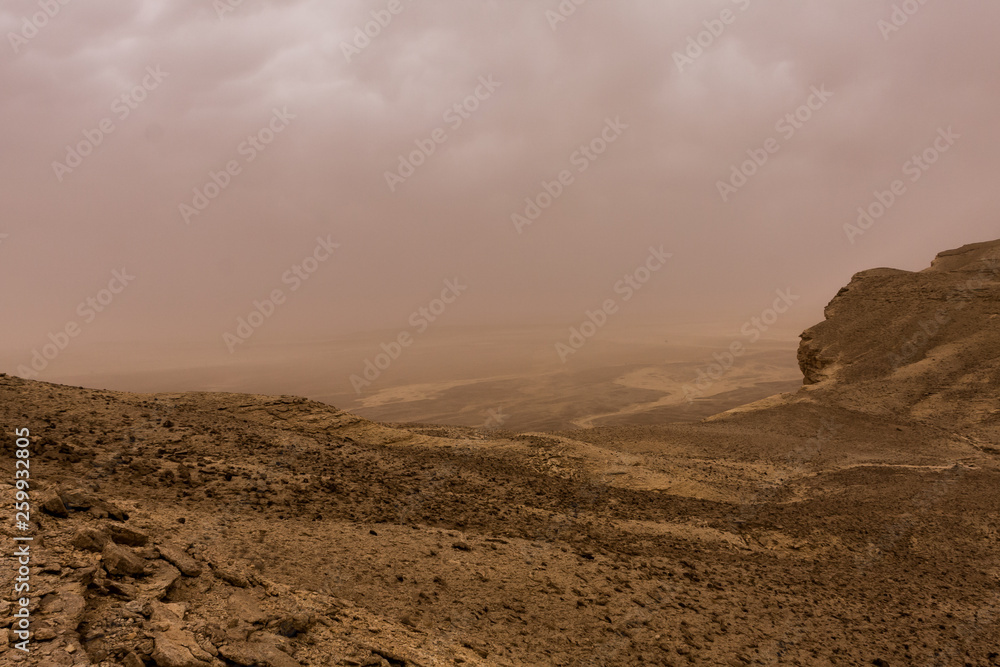 Desert landscape with thunderclouds and sandstorm in Lower Najd, Saudi Arabia